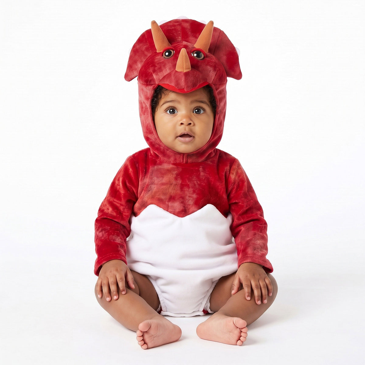 Schattig dinokostuum met zachte pluchen stof, speelse dinokop, opvallende hoorns en een comfortabel pakje