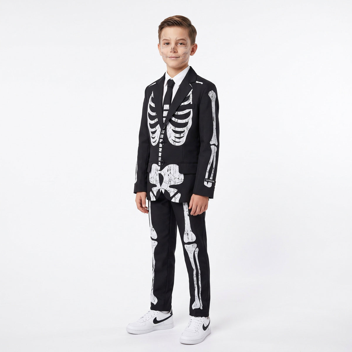 Stijlvol pak met jasje, hemd en das, afgewerkt met een opvallend skeletpatroon voor een mysterieuze, griezelige Halloweenlook.
