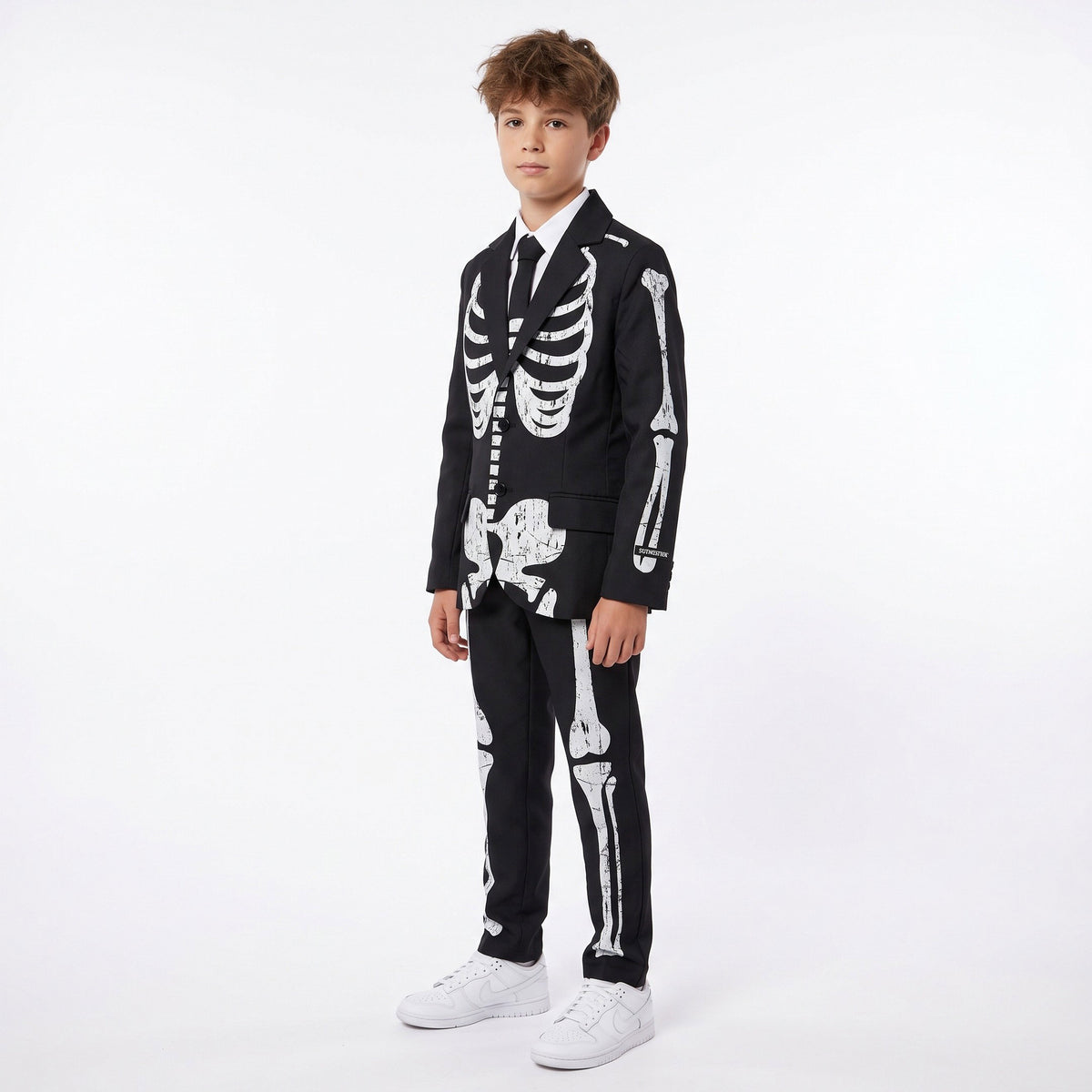 Stijlvol pak met jasje, hemd en das, afgewerkt met een opvallend skeletpatroon voor een mysterieuze, griezelige Halloweenlook.